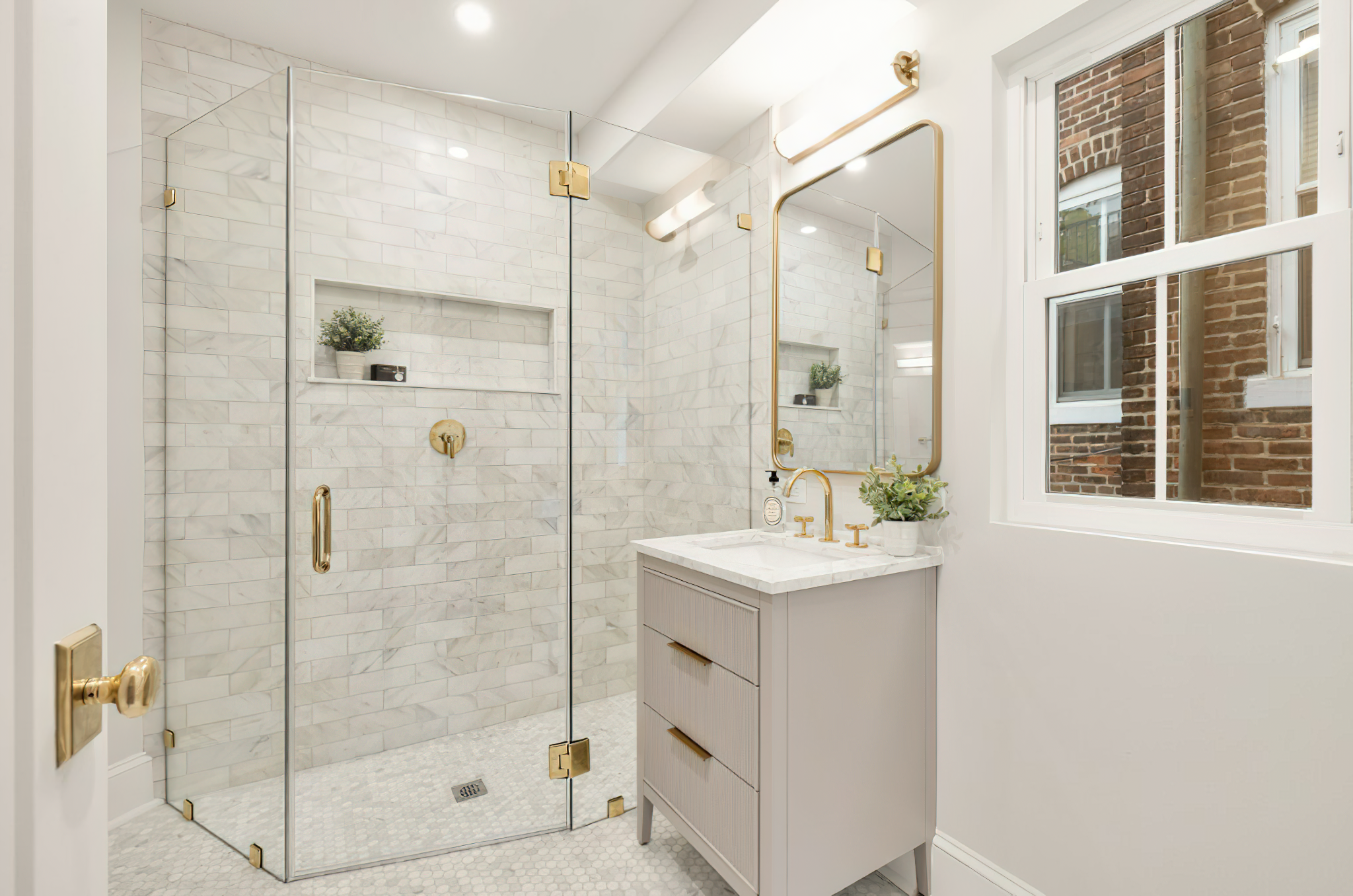Bathroom with gold fixtures – MAAC Construction